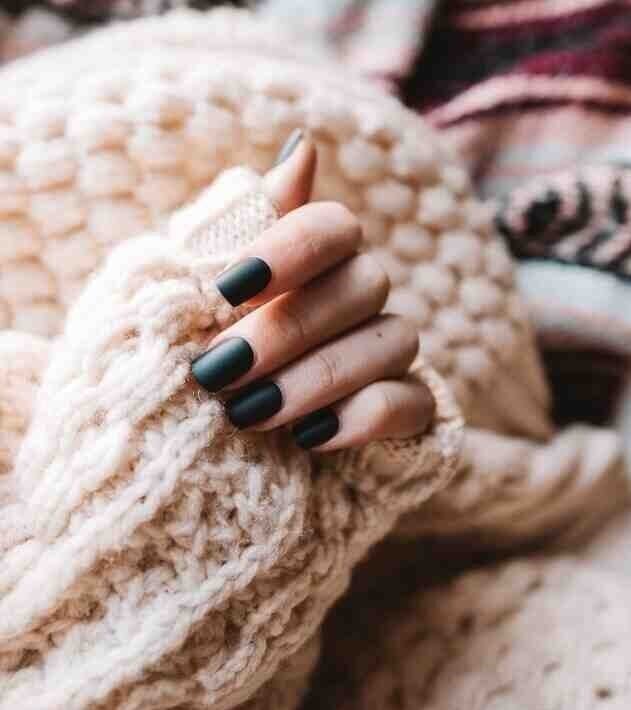 Hand with pink nails with jellyfish
