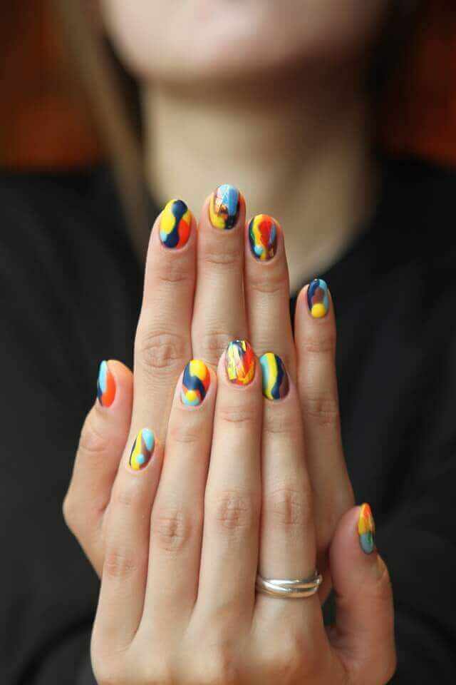Hands with colorful nail design